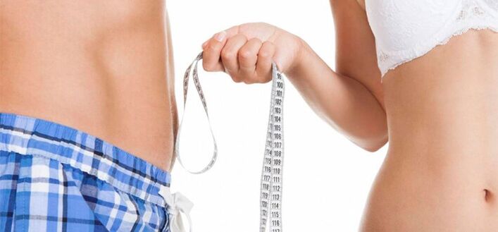 A woman measures a man's penis before enlarging it